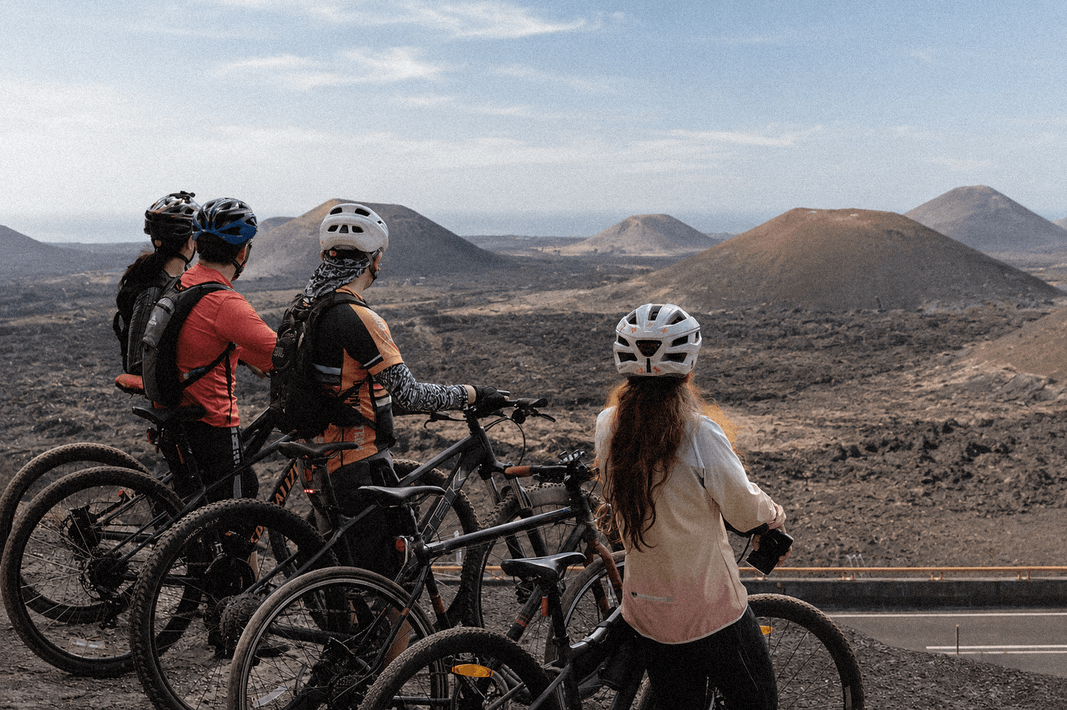 Cyclists in the volcanic landscape of Lanzarote
